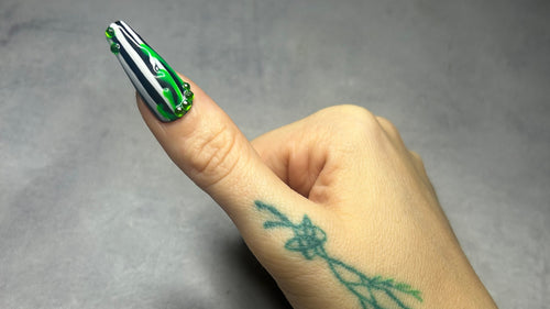Press on Coffin Shaped Bespoke Nail, Hand with tattoo on a Grey Background 